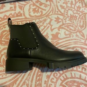 Black Boots, Lug Soles the Lory by Coach. Slip on Leather Uppers, Stud Accents